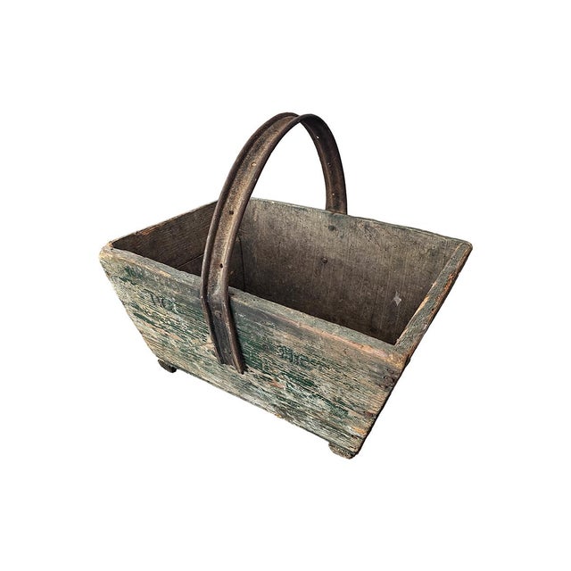 This sturdy wooden basket is an excellent vessel for storing small objects or creating a stunning floral arrangement. It...