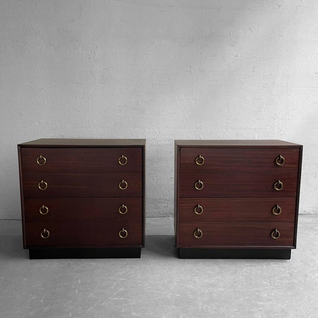Pair of matched, Hollywood Regency, mahogany, 5 drawer dressers attributed to Gilbert Rohde with prominent brass ring...