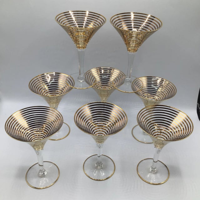 Set of 8 hand blown with gold pin stripes embellished on the bowl. The shape is an elegant design from the 1950’s. Made to...