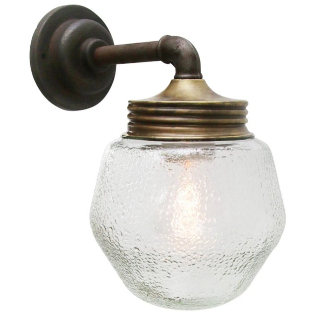Industrial wall lamp. Brass and cast iron Frosted glass. Diameter wall mount 10.5 cm / 4” for use inside only Up to 250V...