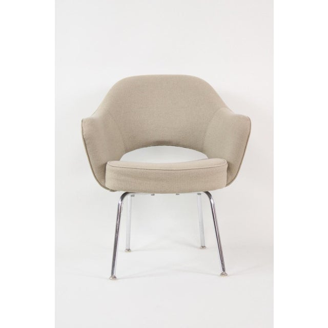 A versatile armless chair attributed to Knoll Executive Chair designed by Saarinen with tan tweed upholstery and tubular...