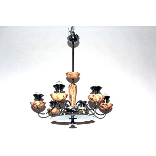 Chandelier made of chrome-plated brass with marbled opal glass bowls, 9-light E14, European Plug (up to 250V).The wiring...