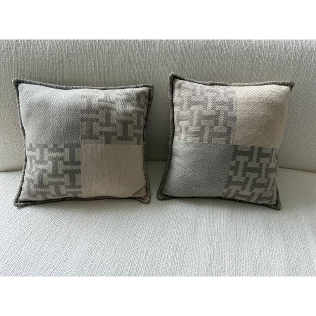 Authentic Hermès Avalon III small model pillows, sold as a pair, in a sophisticated tonal grey colorway. Part of the...