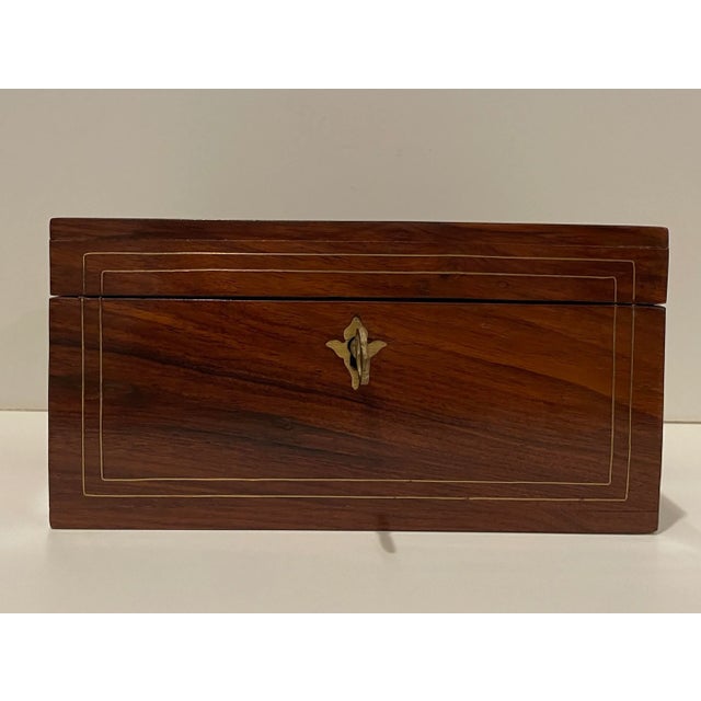 Mahogany and brass box in the form of a 18th century English tea caddy. Benchmade, with brass inlay on the lid and three...