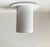 White built-on ceiling light or flush mount in powder coated metal. This design inspired by Gino Sarfatti was created by...