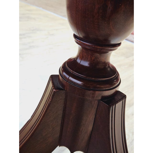 An elegant, extendable dining table made in the second half of the 19th century, in a classic English style, characterized...