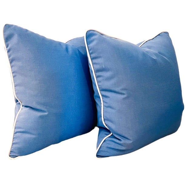 New 22'' pillows in Sunbrella Canvas Air Blue fabric with a white contrast welt. 24'' outdoor inserts included. Zipper...