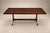 A generously proportioned Brazilian modern dining table attributed to Jorge Zalszupin. The expansive rosewood top reveals...