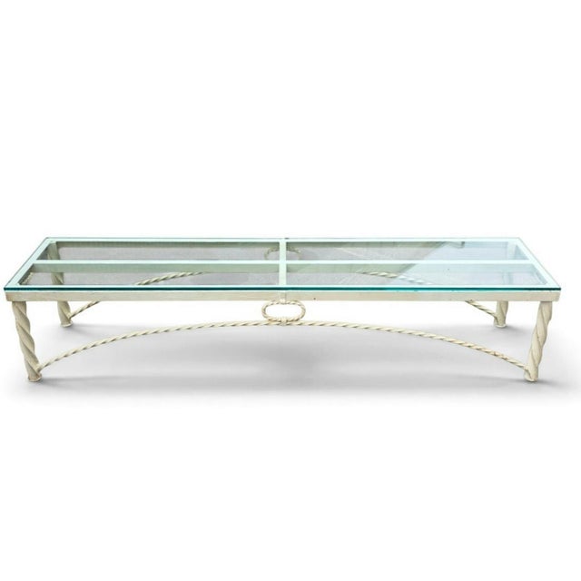 Striking Maison Jansen-style Hollywood Regency coffee table, dating to the 1960s–1970s, featuring an exceptionally long...