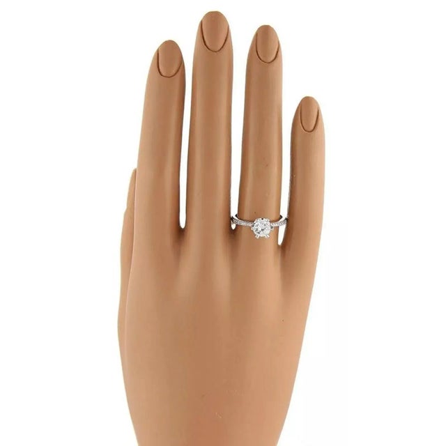 This authentic never worn designer Tacori engagement ring is crafted from solid platinum with a high prong setting of...