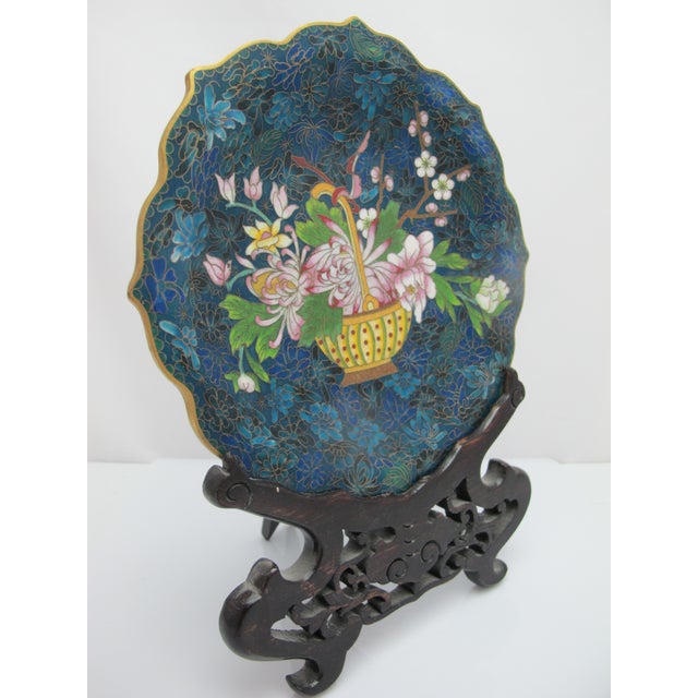 Exceptional Chinese Cloisonne decorative plate. Enameled brass showing intricate blue flower background with brightly...