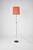 An Italian adjustable floor lamp from the 1960s, defined by its slender chromed structure, circular black base, and...