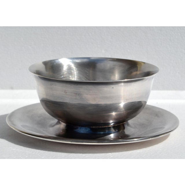 The Wallace 938 Silverplate bowl is a vintage American silver-plated serving piece from the 1950s, featuring an attached...