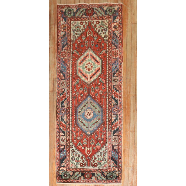An early 20th-century Persian heriz small runner Measures: 2'8'' x 6'10'' Heriz carpets are beloved for their versatility....