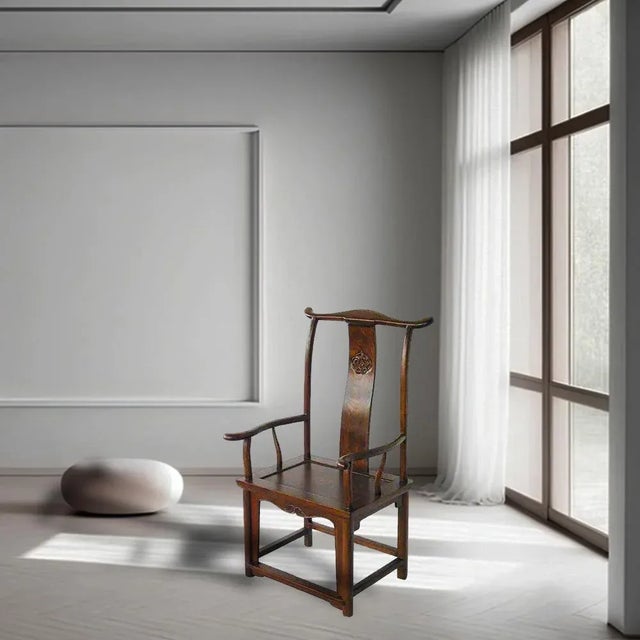 his High Yokeback Armchair is a reproduction of a classical Chinese armchair called Officials Hat Chair designed with the...