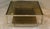 Vintage center table. A modern work of art, with two amber-colored glass shelves.