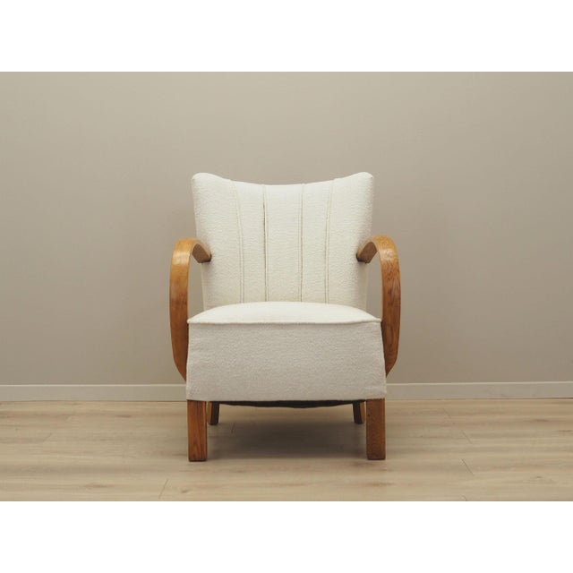 The armchair was made in the 1950s, Art Déco style. The construction is made of oak wood. The wood has been refreshed. The...