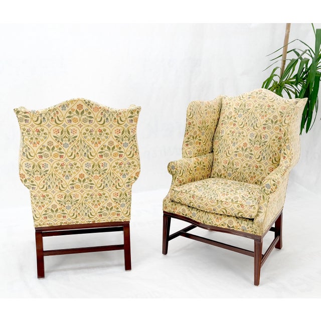 Pair of Deep Profile Antique Wing arm chairs mahogany legs Federal Style.
