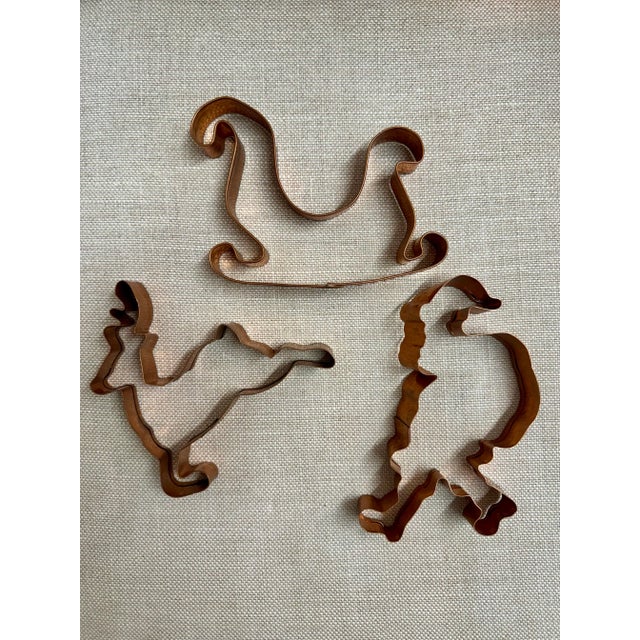 Set of three Christmas motif vintage copper cookie cutters. They can be used as Christmas tree decor/ornaments as well.