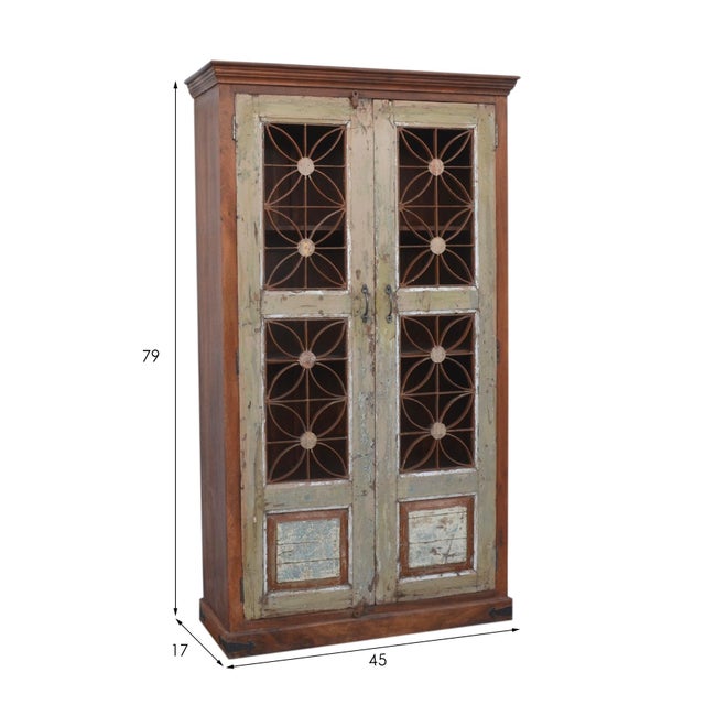 This Reclaimed teak wood Cabinet with decorative iron work features a floral pattern and aged metal handle finish, adding...