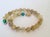 We are delighted to introduce a stunning addition to our collection—a Rutilated Quartz Knotted Necklace accented with two...