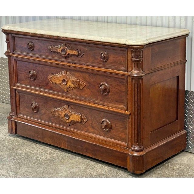 Stunning late 19th century chest features the opulent and detailed aesthetics of the Victorian Renaissance Revival or...