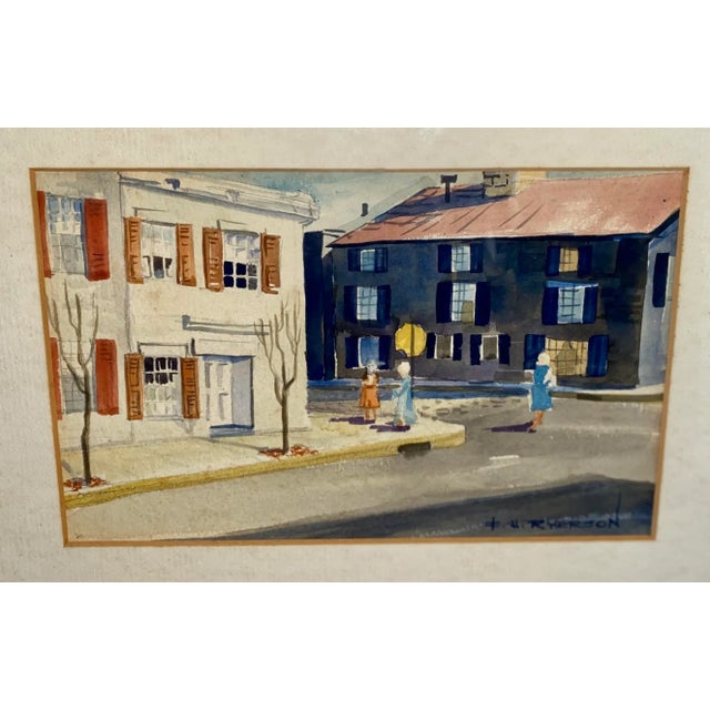 Vintage cityscape watercolor signed E W Ryerson. Image measures 6” x 9”. Matted and framed under glass, measures 12” x...