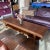 Solid walnut coffee table with shelf by Lane Furniture. Makers mark on underside. Very heavy and sturdy....doubles as a...