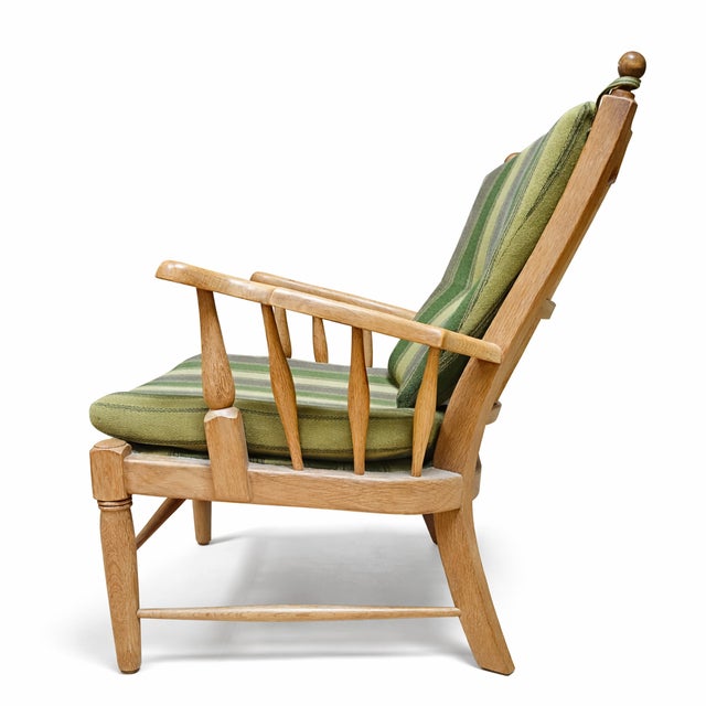 Danish lounge chair attributed to Henning Kjærnulf, produced by EG Kvalitetsmøbel in Denmark during the 1960s. The chair...