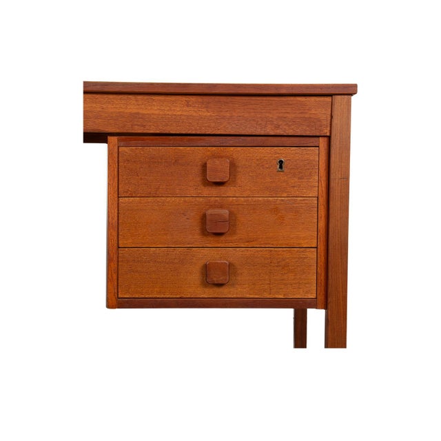 Beautiful remarkable statement in design and craftsmanship. This mid-century teak Danish desk, precisely crafted in...