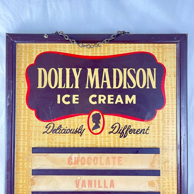 A hanging Dolly Madison Ice Cream Lithographed Tin Flavor Board, circa late 1940s. Ice Cream and soda flavor boards were...