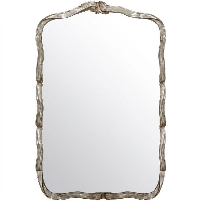 The Bandeau embraces the soft romance of the Rococo, its shaped silver frame rippling in gentle waves around a generous...