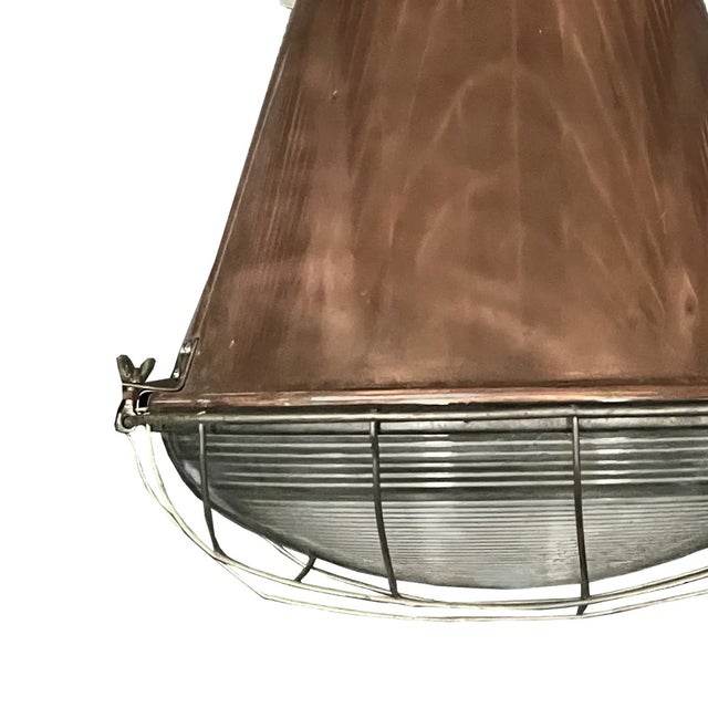 Mid-century copper pendant light originating from the United States.