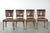 We are offering this set of 4 vintage cowhide leather and wooden dining chairs with a beautiful, characterful, and elegant...