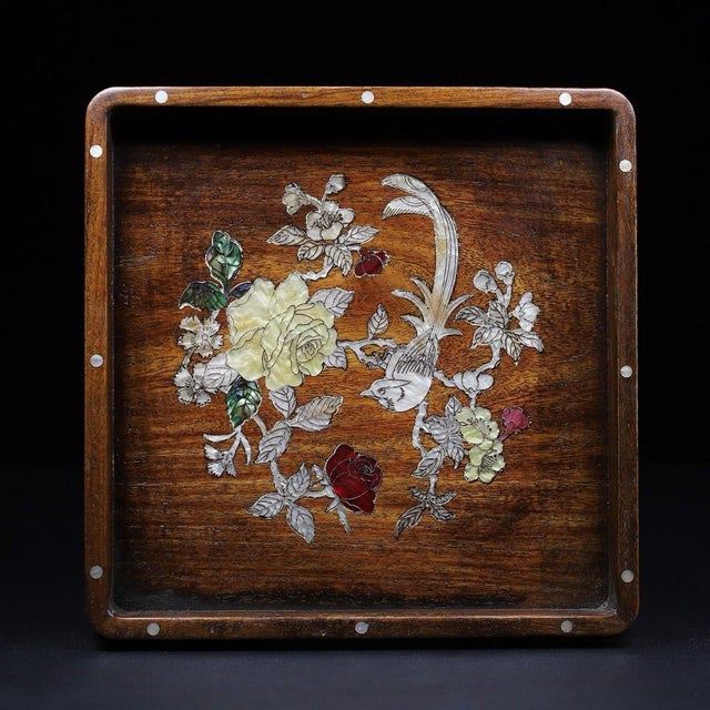 This is an exquisitely crafted square wooden tray featuring intricate mother-of-pearl (nacre) inlay work. Crafted from a...