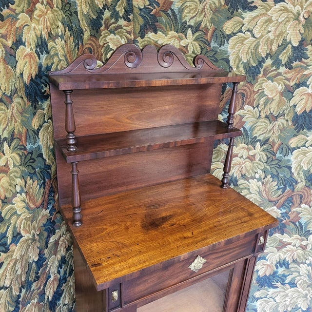 Hutton-Clarke Antiques is pleased to offer a unique and narrow chiffonier from the Regency period. Crafted from mahogany,...