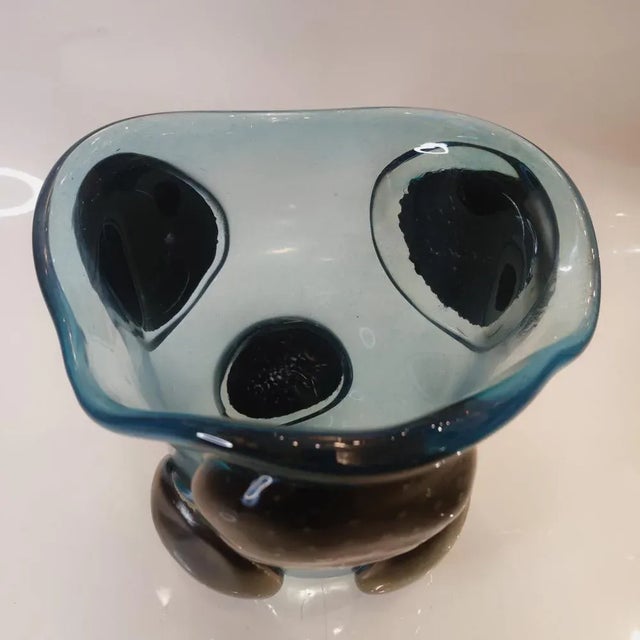 Beautiful Murano vase from Venice, Italy. It stands out for its great black circular forms on a brilliant blue base that...