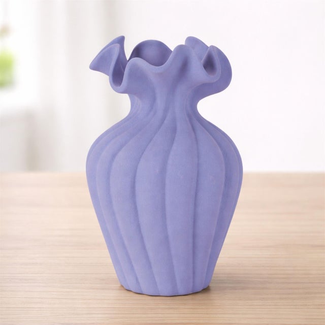 Make a bold yet graceful statement with this Scalloped Ribbed Stoneware Vase. Featuring a beautifully flared, wavy rim and...