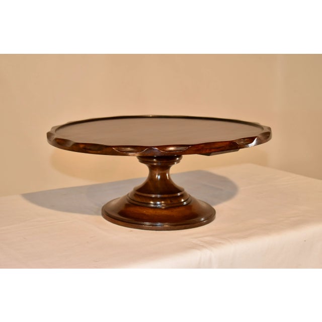 19th century English lazy Susan made from mahogany. The top is beautifully grained and has a molded pie crust edge, which...