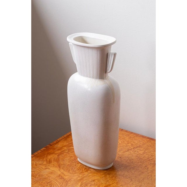 Rare large vase designed by gunnar nylund. Hand made at rörstrand during the 1950s. Made from stoneware with a white egg...