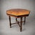 A beautiful antique burr walnut dining table featuring a striking octagonal top with rich, highly figured grain. The...