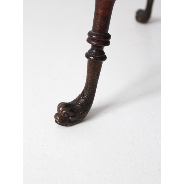 This is an antique wooden table with barley twist legs. The beautifully detailed end table features the classic...