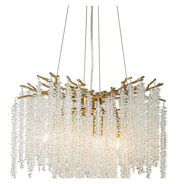 This ALOADECOR chandelier features an antique brass branch-style frame with clear crystal accents inspired by the quiet...