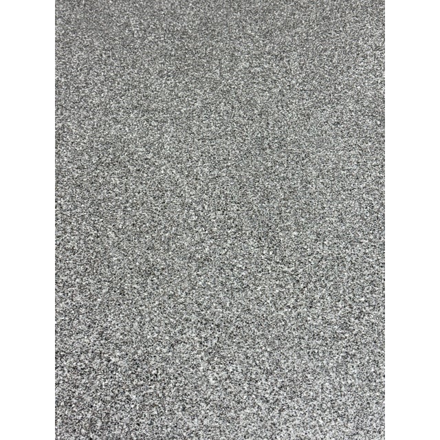 Design Plus Gallery presents a Post Modern Pedestal Dining Table from the 1980's. The table has a black metal base in a...