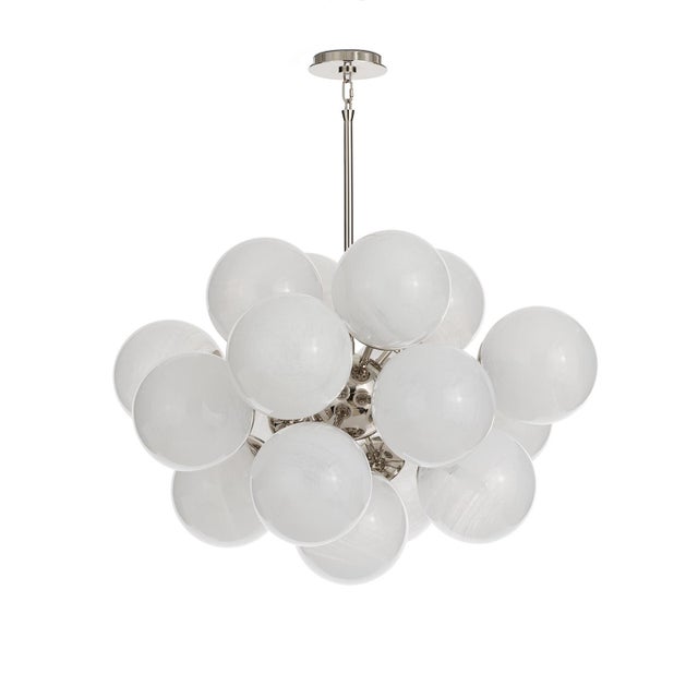 The Shine Chandelier is a beacon of joy, evoking the whimsy of a cluster of balloons with a nod to mid-century modern...