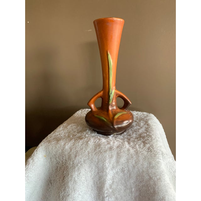 Rosevillel Freesia Bud Vase 195-7, very good condition with one 1/4" chip rip on top of lip.