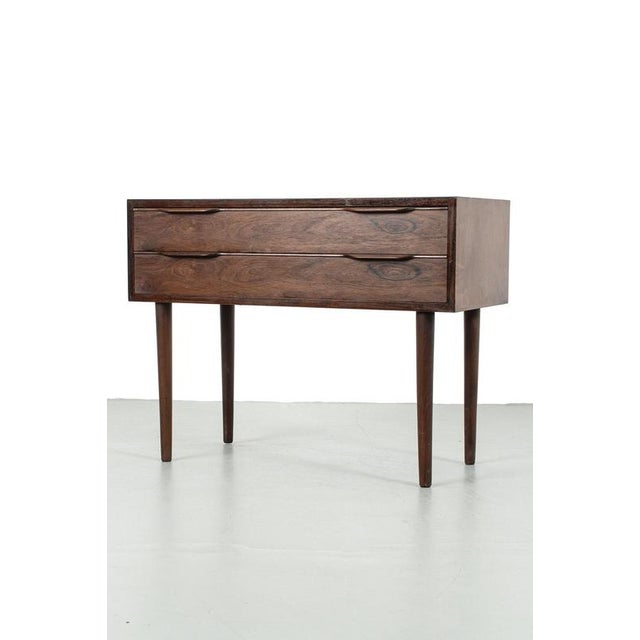 Danish cabinet with drawers and beautiful details. This cabinet is made from dark wood veneer. In a good vintage...