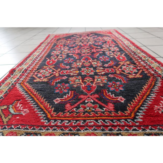 Step into a world of timeless allure with the Handmade Vintage Persian Hamadan Rug. Design and Aesthetics: Crafted in the...