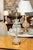 This is an elegant pair of French glass table lamps featuring hand-blown clear ribbed glass urn-form bodies with matching...
