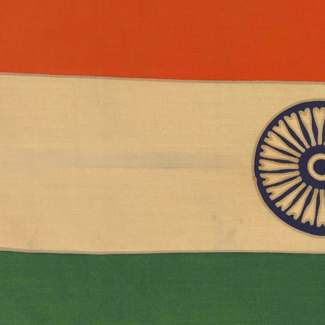 This vintage Indian flag is made from a wool cloth with printed design visible on both sides. Please note staining and...